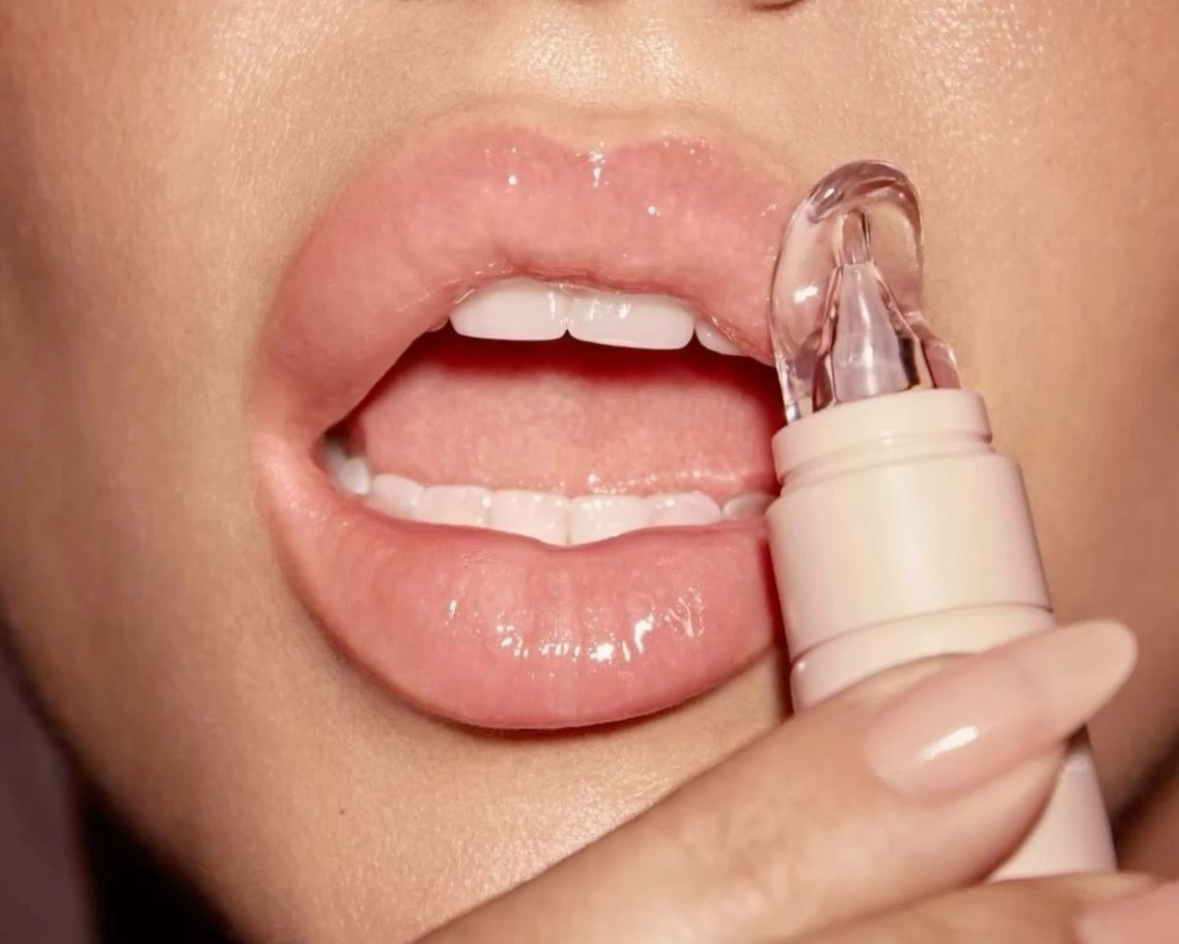 Lip balm being applied to lips with a close-up view